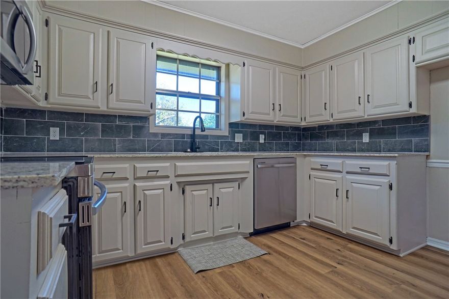 Discover modern comfort and classic charm in this beautifully updated home. Featuring an open-concept floor plan, this 3-bedroom, 2-bath property is perfect for both entertaining and everyday living. The spacious living area includes a cozy fireplace with insert and flows seamlessly into the dining and kitchen spaces.
The remodeled kitchen showcases new granite countertops, new hardware, fresh paint, brand new appliances (no fridge), and all-new luxury vinyl and tile flooring throughout the home. Bathrooms have been completely remodeled with modern finishes. Enjoy peace of mind with a new roof (2 years old), upgraded attic insulation, new 2 speed HVAC system, and all-new light fixtures and ceiling fans. Step outside to a large new deck overlooking a fully fenced backyard with fresh zoysia sod in the front. This home blends style, comfort, and convenience ā ready for you to move in and make it your own!