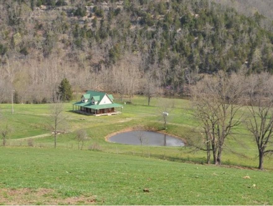 Yocum Creekfront Ranch.  325-acre m/l Hunting and fishing Playground with 1 mile of Yocum Creek w/ Confluence to Table Rock Lake. Fenced and cross fenced. 200 ac in Fenced pasture and 125 ac mature timber.
Listen to the creek and watch the Eagles and Blue Herons on the porch of the Cabin. 3 Bedroom 2 3/4 bath Cabin overlooking the creek and big mountain views, wrap around porch. 40 X 40 barn, 10-acre tree farm, 3 caves, huge bluffs, an old mine, cave hollow & old schoolhouse foundation, rocks and springs, a riding trail and an old postal trail. Lots of history.   PRIVATE -End of the road location. Gated. Located 30 minutes to Branson MO, Big Cedar Lodge/ Golf course, Dogwood Canyon Nature Park and 2 Marinas. Scenic and Remote. Great Vacation Rental with many building sites.