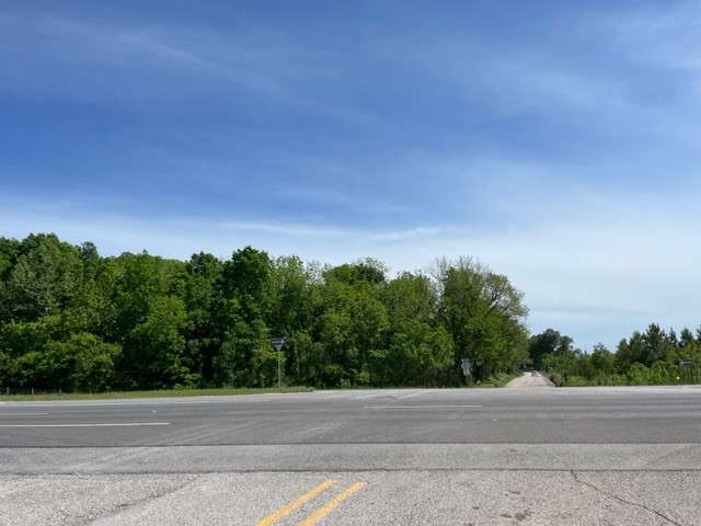 7.48 Acres on the Southeast corner of Highway 412 and Robinson Road. This property offers high potential and various opportunities with almost 900' of Highway 412 frontage and only approximately 4 miles from the incoming Highway 612 Interchange. Buyer to verify utilities. Agent owned.