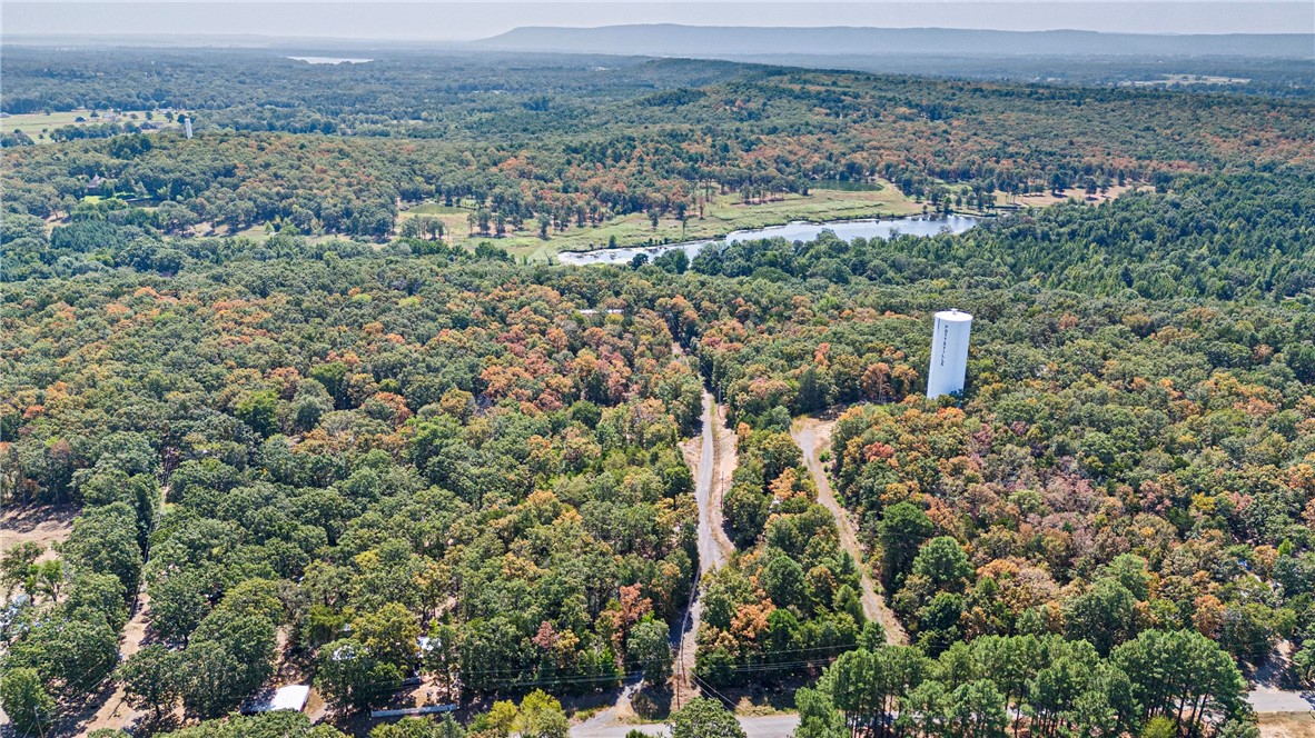 Discover 5.93 acres of gated, rectangular-shaped land with a gentle slope upward, offering privacy and scenic views. The property includes a manufactured home ready for remodeling, perfect for creating a custom residence or income property. A second building site is in place with power, water, and a septic system, making expansion or new construction easier. A storage building provides space for tools, equipment, or recreational gear. The upward slope enhances the possibilities for building with a view, landscaping, or creating tiered outdoor spaces. Whether youāre seeking a renovation project, investment opportunity, or a private retreat with room to grow, this acreage delivers valuable infrastructure and great potential. Located in a peaceful setting yet convenient to local amenities, itās an ideal canvas for your vision.