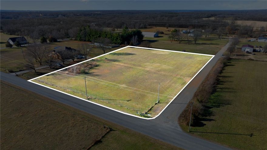 2 ac mol on the corner of Taylor Orchard and Hunters Xing, needs septic, water is on Taylor Orchard (buyer to confirm availability), subject to a new survey. The additional 3 ac mol with home are available per separate listing! Enjoy your dreams right here! Build it!