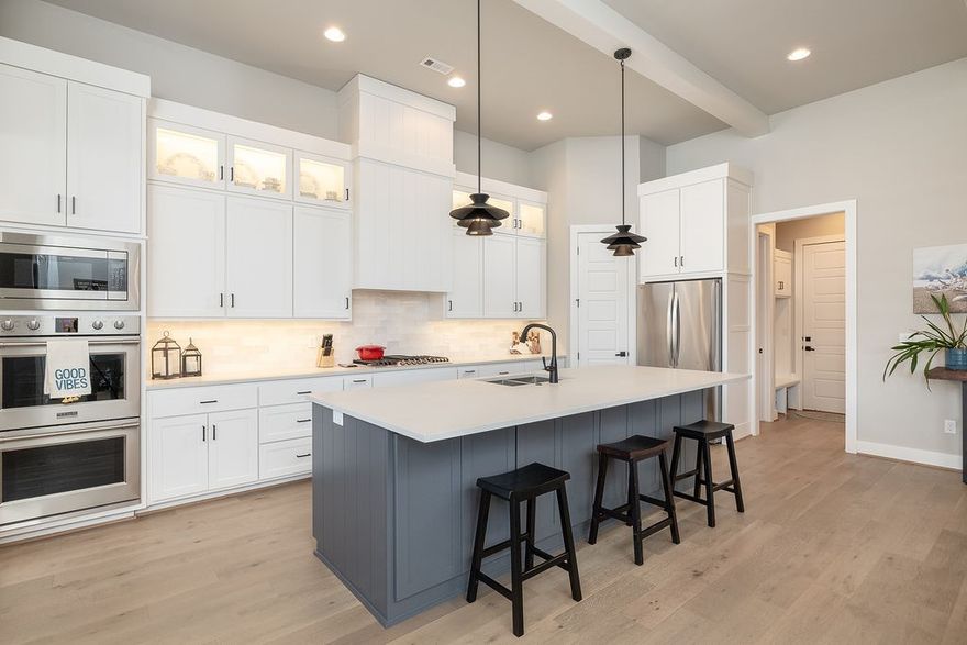 Experience luxury living in this immaculate single level home in sought-after Aurora! Upon entry, the impressive open concept leads you in with soaring ceilings opening to the spacious living room/chef’s kitchen & sun-filled dining area! You will find it impossible to pick a favorite feature as this home is brimming w/extras such as plantation shutters, wood flooring, modern marble FP, huge center island, double ovens, gas range, abundant cabinetry & pantry just to name a few! The primary suite is complimented by a large spa centered bathroom & generous walk-in closet. The 3 guest suites are nicely positioned making this layout one of the best you can find! Great flat fenced yard, covered patio, 3 car garage & ideal location just a minute walk to the community amenities of swimming, pickleball, BB, playground & dog park! Minutes to top-rated Bentonville Schools & only 7 miles to WM Home office & downtown Bentonville!