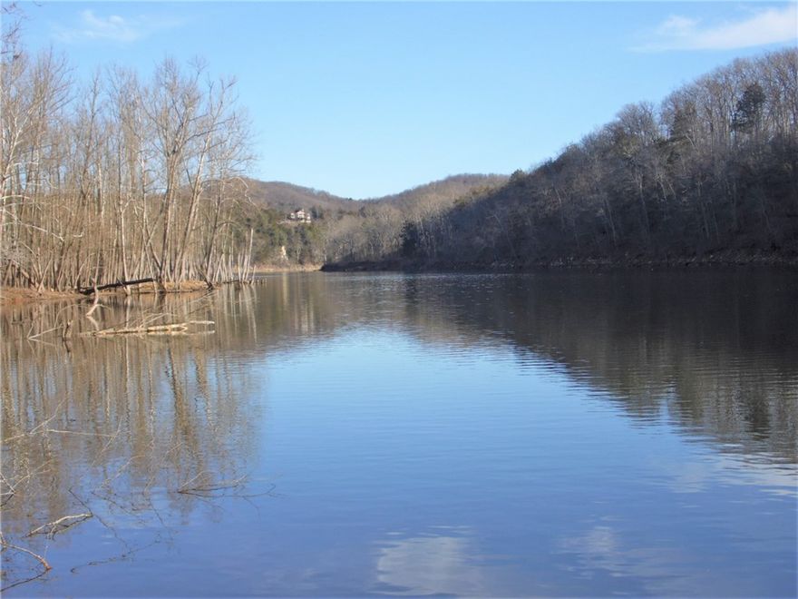 Rare, large acreage on White River.  Terrific private property with gentle walkdown to the river.  Gorgeous, wooded property with mature trees for great hunting, hiking, or exploring, and then the open pasture bottomland right on the sparkling White River.  Fish, boat, kayak or canoe with ease.  Spacious  one level home offers plenty of comfortable living space, indoors and out, plus tons of storage for all your toys with attached 3 and 2 car garages.  Great garden area, too.  Could be wonderful family or hunting retreat.  Even has 3 RV hookups for your guests!  The grounds around the home are rolling and park like, but the generous 160+ acres has the hills, seasonal creeks, and varied topography the Ozarks is famous for with the crowning jewel, of course, being the river, with fascinating bluff line on the opposite side but with the amazing bottomland pasture frontage on this property.  Located just minutes from Beaver Lake, Eureka Springs, and the iconic, historic bridge at Beaver Town.