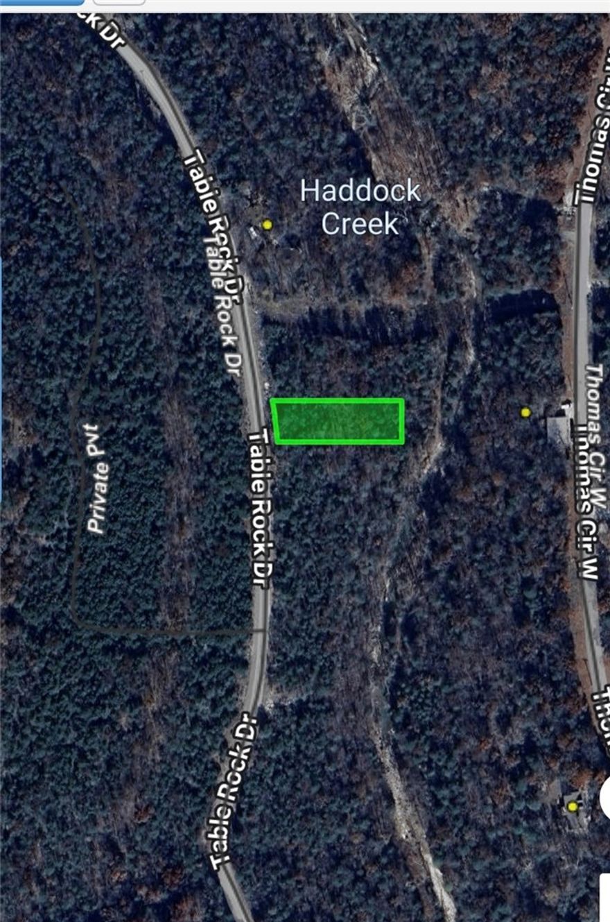 Build your dream home in the heart of the Ozarks on this beautiful 0.38-acre lot nestled in a quiet, secluded area of Holiday Island. Backing up to a peaceful creek, this property offers a serene natural setting perfect for relaxation and privacy. Conveniently located just minutes from everything Holiday Island has to offer, including the Table Rock Lake marina, recreation center with pool, tennis and pickleball courts, mini golf, a 9-hole executive golf course, and an 18-hole championship course. Enjoy close proximity to Table Rock Lake with access to the marina, fishing dock, boat launch, and nearby park. Utilities are ready with water and sewer on site, making building easy. Shopping, dining, and banking are nearby, with downtown Eureka Springs just 15 minutes away, Branson 45 minutes, and Berryville 30 minutes. Ideal for a full-time home or peaceful getaway.