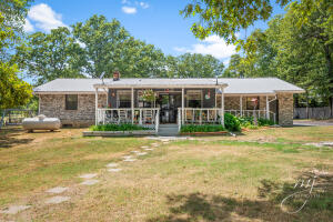 First time on the market for this 3-4 BR 3 BA home sitting on approx. 5 parklike acres just N of Bergman School. Upon entering the property, you'll appreciate the wood fenced front and paved drive. The 24'x34' shop building is great for storage or workshop. There is a separate septic and water hookup behind the shop if you want to add that mother-in-law house or park a trailer. Fence off a couple of the back acres and raise your own livestock. Lots of options with this property. Only 15 minutes to Harrison or Bull Shoals Lake.