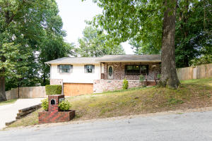 Nice floor plan in this solid, well built home sitting on a large lot with mature shade trees. Enjoy a spacious backyard completely enclosed with a privacy fence. This Extra nice 3 bedroom 2 bath brick home is located conveniently in Harrison, has a great kitchen with lots of cabinet space, adjustable shelves and storage options, a kitchen pantry and newer stainless steel appliances. This Home has the perfect charm with New Dark Wood floors, wood paneled doors with over-size ornate trim through out the home. Large Master Bedroom with 2 walk-in closets and Master Bath. Sun-room is an added bonus for your entertaining on the large deck overlooking your back yard full of mature trees! Heat/Cool unit new in 2014. New Garage door, plus many other updates to modernize the home.