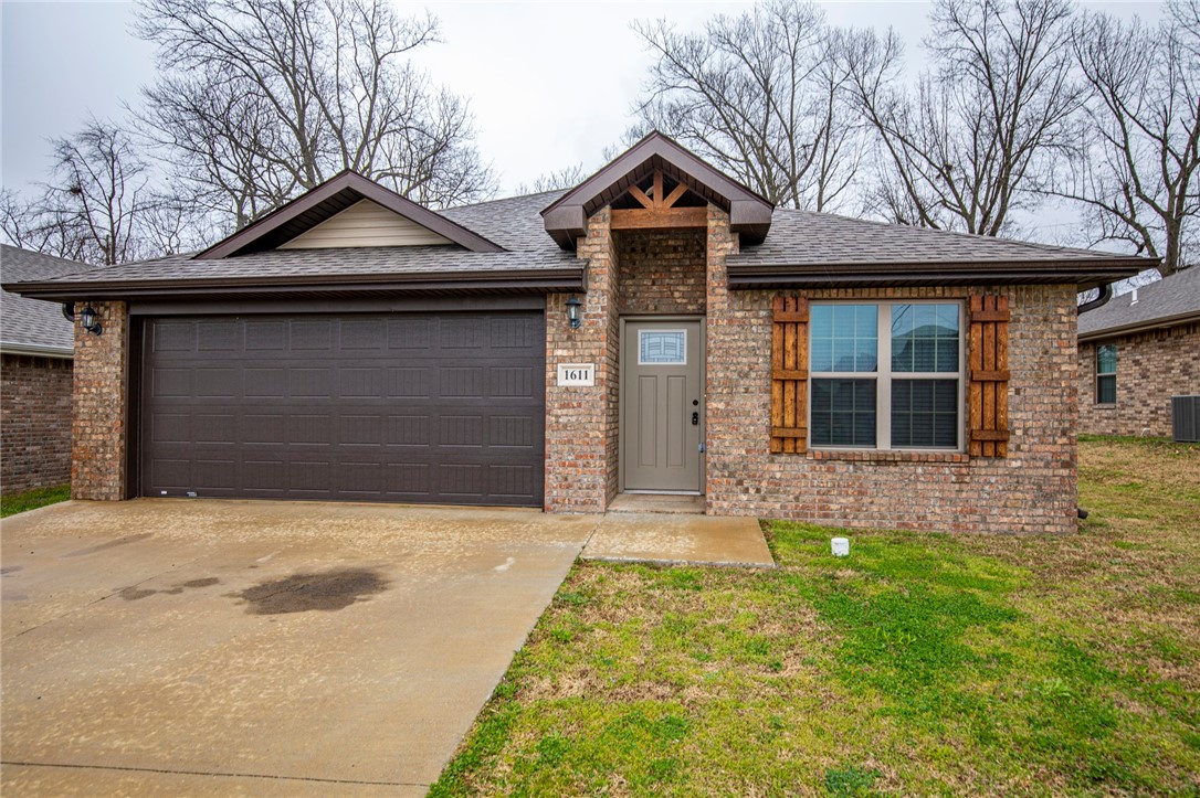 Great home on the east side of Rogers. This 3 bedroom 2 bath home features engineered wood flooring and vaulted ceiling that continues into the open kitchen. Kitchen features pantry, granite counters and includes over range microwave and large dining area. Master suite has duel sinks and large walk-in closet. Fenced yard.