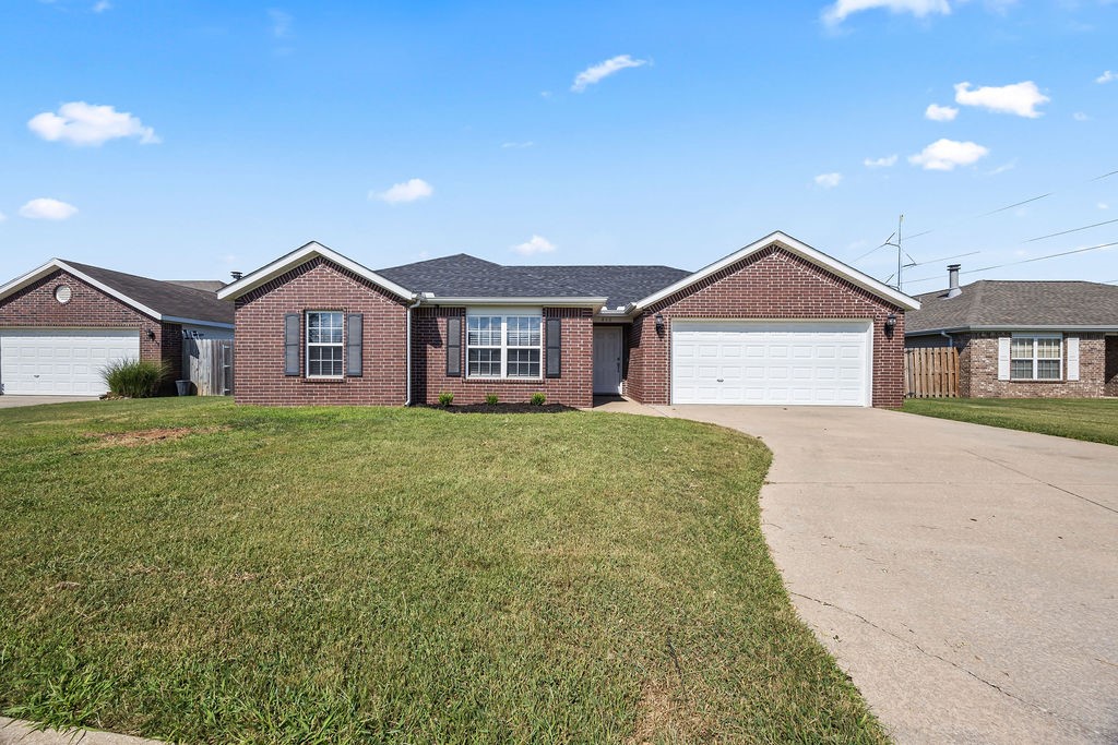 Don't miss this great 4 BR 2 BA home in the heart of Bentonville. Close to shopping and plenty of restaurants, this one is a real charmer! The spacious living area features a wood burning fireplace, crown molding, and tray ceilings. The kitchen has been updated with painted cabinets, a double oven range, and has a great eat-in area and bar. No carpet in the home makes clean up a breeze, with wood look tile installed throughout the home! Much of the lighting has been upgraded with LED lights, new ceiling fans, and kitchen lights with a nightlight feature. The upgrades continue outside as well, and features a roof that is only 4 years old and a huge privacy fenced back yard ready to enjoy! Come and see this one before it is gone!