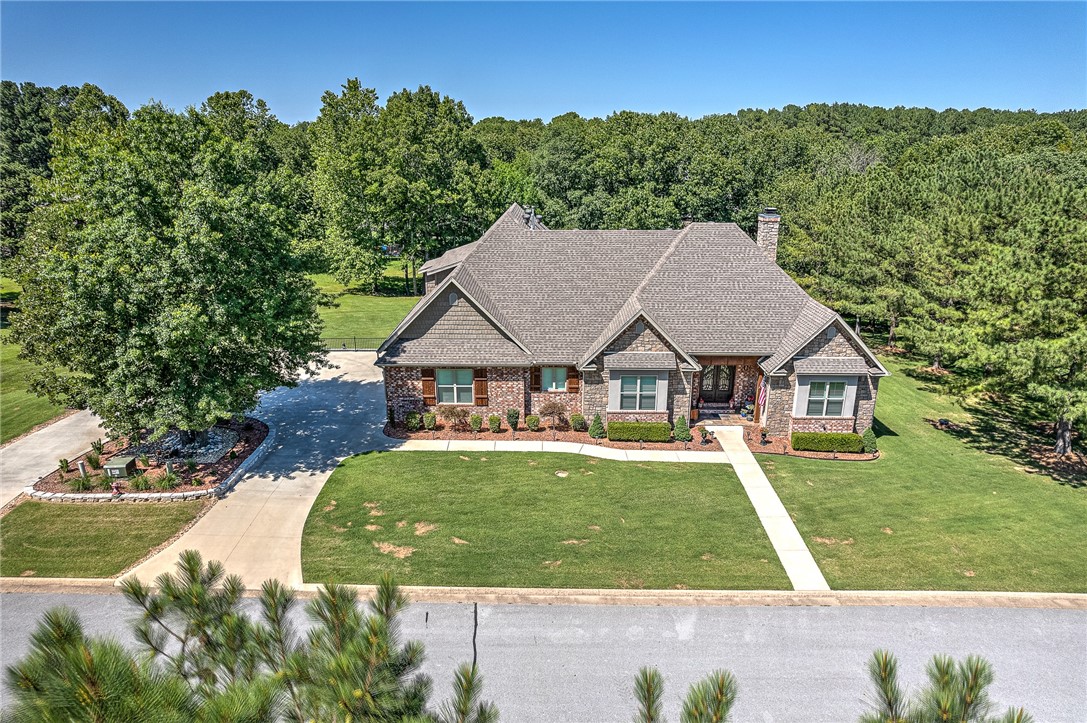 Amazing custom build home in 2018, 1/4 mile to Horseshoe bend state park Boat Ramp. 4 Bed and 4 FULL Bath. Screened/Plexiglas sunroom with air/heat (included in square footage) 1.39 Acres with mature trees. 2 added storage spaces in crawl space with 1 dehumidifier to convey to keep it dry. Upstairs bonus/4th bed is insulated for sound. Wood storage in built in cabinet to left of woodstove. Extra fridge in garage to convey. All windows have plantation blinds. Lots of floored attic space for easy access. Wood look tile floors throughout main floor. Built in outdoor kitchen in sunroom with vent hood over grill and mini fridge. Massive outdoor deck overlooking this beautiful yard. Porch Swings under deck to watch all the deer in the evening. Absolutely a dream home.