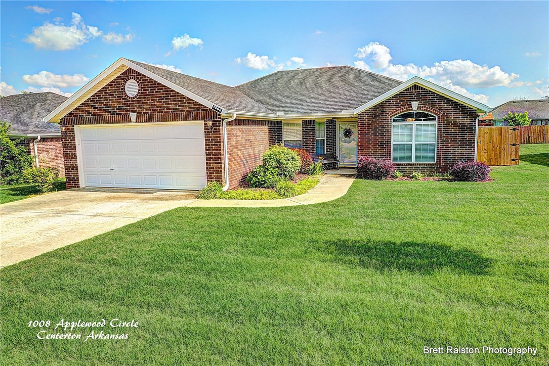 Beautiful 3 bedroom, 2 bath, 2 car garage, all brick home in Centerton. His and Hers closets in the master bathroom, fenced in back yard, fire place in the living room.
