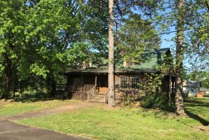 Property in multiple offer round, deadline is Thursday, 2/28 at noon.Located just outside of town is where you will find this spacious log home with room for all your hobbies and family!!! Home features wonderful porches for enjoying iced tea and watching the sunsets, inside there is 3 fireplaces to enjoy winter nights sipping cocoa. Large family room for gathering family around for the holidays. Basement has so much potential and could be used for so many things.