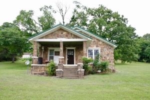 This is an absolute gem that just needs a little polishing. The bones are all there and ready for you to add your own personal style and make it your own. This historic home is beautiful stone work that has stood the test of time well and ready for many many more years. There is also a metal roof. The inside is a blank slate for you to create your dream home. This would be a great fix and flip, rental, or long term home for somebody. Call today for your showing.