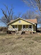 This is a cute 2 bedroom 1 bath home that includes a 2 car garage and shop building. There is a creek on the property and room for some horses or cattle.