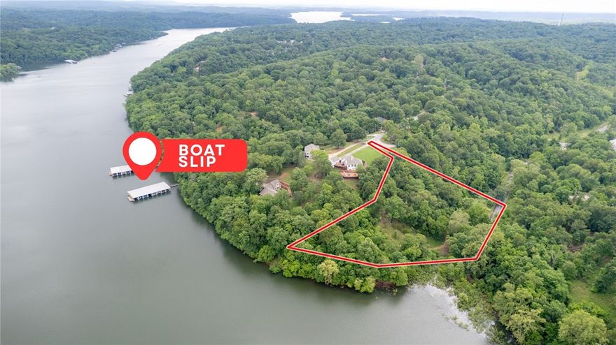 Mountain Lake Estates Lot w/Boat Slip! This 2 Acre Lot has wooded setting and easy access to Beaver Lake Including a boat slip in the community dock. The property is a perfect setting for your lake home build with electric/gas/water at street. Located in sought after Lake Community just a short drive to Downtown Rogers shopping, dining, and entertaining. Don’t miss out on this fantastic lakefront opportunity!