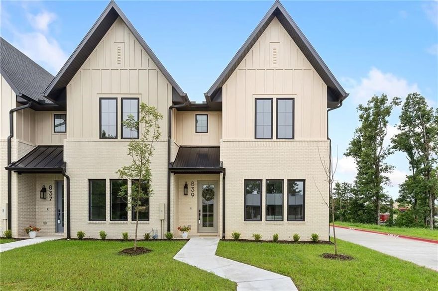 Experience low-maintenance living and modern convenience in this newly completed interior-unit townhome just minutes from Downtown Bentonville. Enjoy quick access to the Square, Crystal Bridges, AWSOM, local trails, and I-49—placing the best of Bentonville right at your doorstep. Inside, luxury vinyl plank flooring runs throughout, complementing the open-concept kitchen, dining, and living area designed for everyday comfort and entertaining. The kitchen features quartz countertops and sleek finishes, while a Ring doorbell adds extra peace of mind. Upstairs, the primary suite offers a spacious ensuite bath and an oversized walk-in closet. Two additional bedrooms share a large full bath, and the generous flex space provides versatility for a home office, media lounge, or workout area. A centrally located oversized laundry room adds everyday ease. The attached two-car garage includes keypad entry and an EV charger on each side. Thoughtfully designed and move-in ready, this townhome blends style and convenience.