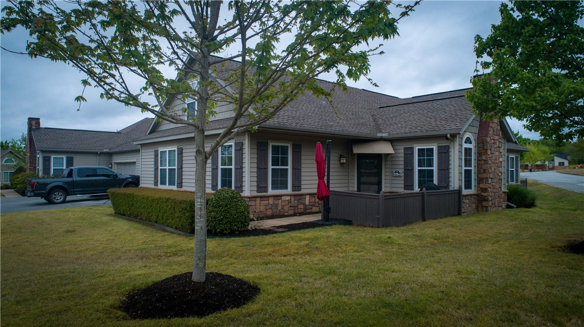 Maintenance-free, resting/recreation-community Lifestyle! Barely lived in, like new, & Pre-Inspected home! Granite counter tops, black appliances, vaulted ceilings, fireplace, neutral colors, and double car garage. Storage upon storage options in one of the only models in the community w/ an upstairs bonus area for living & entertaining. Very nice professional landscaped, pool and clubhouse with meeting rooms, party rooms, pool table, and fitness room. Convenient location! Across from the old Razorback Golf Course. HOA fee takes care of all lawn care, landscaping, and insurance on condo exterior. Quiet area and well maintained. Carefree living at its best!