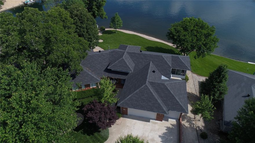 What a view! This could be the best lot on the lake, one of few with a gentle slope that you can walk to your private boat dock. This 3 bedroom custom built, well maintained, one owner home has an open floor plan, office, and 3 car garage. Finished walk-out basement with second kitchen, and living area. Geothermal HVAC, lake fed irrigation, radiant heated basement floor, wired for back-up generator, and so much more. You don't want to miss out on this one. Dining room chandelier does not convey.