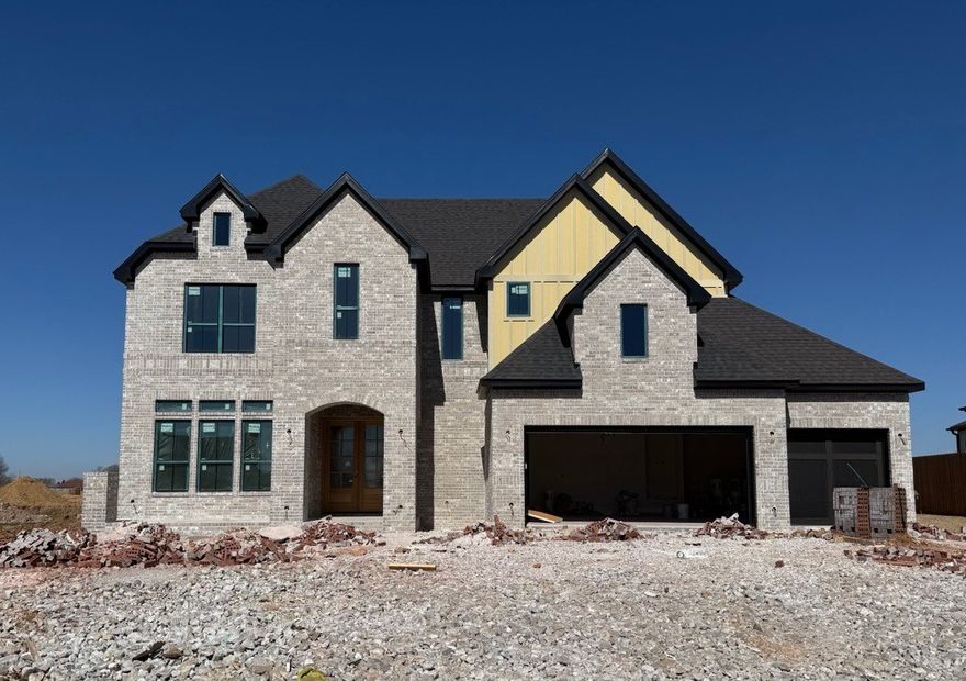 The Monroe is a two-story estate plan filled with natural light. The home features double front doors leading into a welcoming living room with direct access to the outdoor patio. The open layout includes a kitchen with a large island that offers additional seating, a breakfast nook, and a walk-in pantry. The owner’s suite is located at the back of the home with a walk-in closet and a bathroom that includes a freestanding tub. Also on the first floor are a secondary bedroom and full bath, along with a three-car garage connected to the utility room. Upstairs, you’ll find a media room, three bedrooms, and two additional bathrooms, along with a catwalk overlooking the two-story foyer.