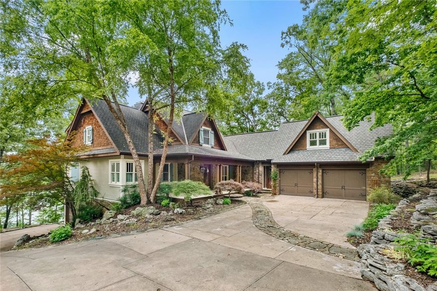 Straight out of a storybook & craftmanship of a true custom build, this one-of-a-kind lakefront retreat sits on 2.56 private, wooded acres near Starkey Marina. Thoughtfully designed & meticulously maintained, home offers 5,064 SF on 2 levels w/richly detailed living space w/1,965 SF partially finished basement—all filled w/high-end finishes. Inlaid wood floors, stained/leaded glass, custom cabinetry, iron railings, & built-ins, every inch reflects exceptional quality & care. The chef’s kitchen w/Viking appliances, Sub Zero fridge, 2 sinks & dishwashers perfect for entertaining or everyday elegance. 3 En-suite bedrooms (1 w/loft), screened-in porch overlooking lake, & upper-level bonus room w/kitchenette, game & office space. The lower level includes a cozy living room w/wood-burning stove, full bath, & plumbed for future kitchen. Also includes 3-car garage, outdoor shower & gentle slope to the water. Rare bonus includes adjoining lakefront lot offering more privacy/future potential. Lakeside living at its finest.