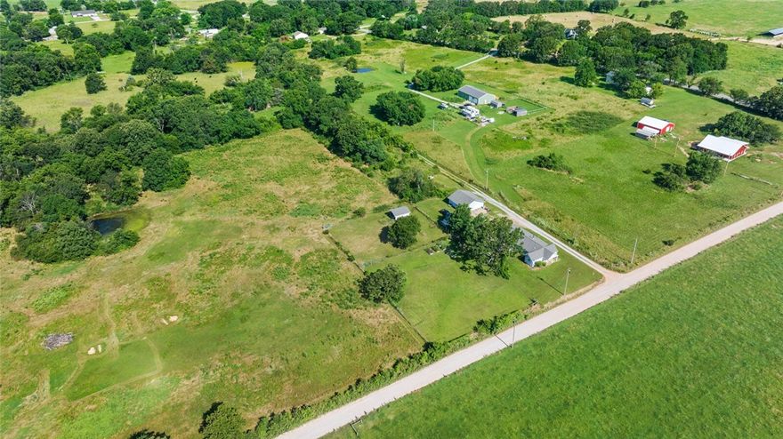 Discover your own private slice of country paradise on this beautiful 4.56 acre parcel nestled in the peaceful countryside of Gravette. Perfectly suited for your dream home, recreational retreat, or small farm, this gently rolling land features mature trees, open pasture, and a scenic pond — ideal for fishing, relaxing, or attracting wildlife. Whether you're looking to build, invest, or just escape the city, this property offers endless possibilities. With road frontage, electric nearby, and no HOA restrictions, it’s ready for your vision.