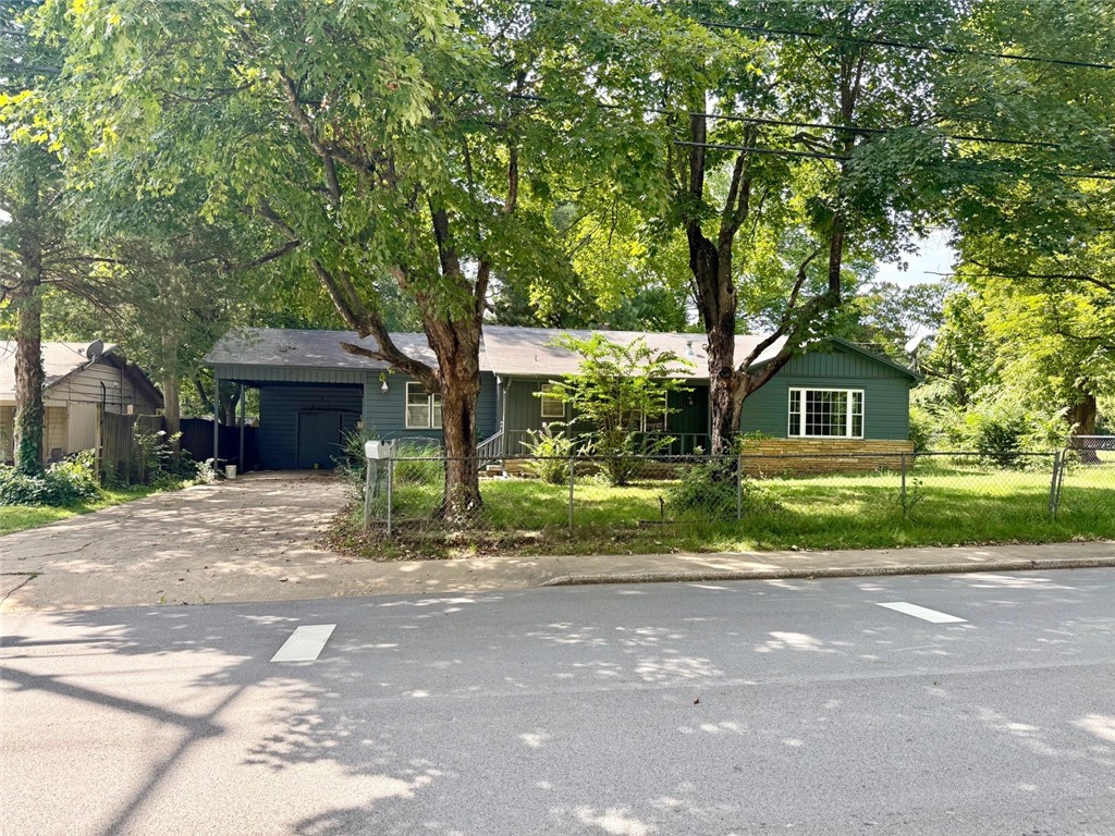 Looking for a home in the heart of Fayetteville? This spacious 1328 SF, 3 BR, 2 BA home has a large backyard and a lot of personality. It would also make a great rental with its location being so close to the University right off MLK. Currently zoned RMF24. Right next to it is RI-U zoning. Washer/dryer, dishwasher & stove do not convey. Large playground in back yard will be removed, along with stone that has a picture on it. AS IS