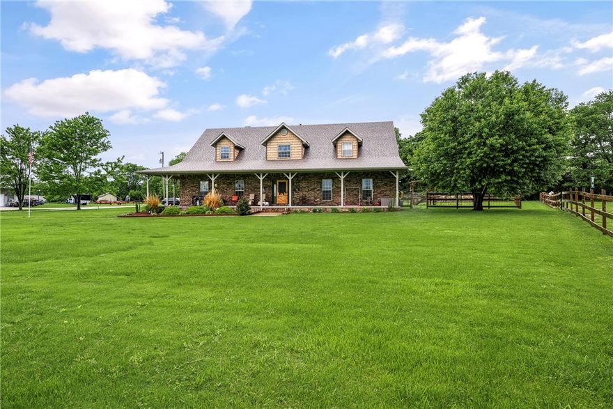 Enjoy perfect blend of country living and city convenience with this spacious property set on 9 beautiful acres within city limits. This unique home features 3 bedrooms, each has its own private full bathroom, plus additional 2 half baths-ideal for comfort and privacy.  Also room just for office w/o closet. Conveniently located near schools and a park, the home has been updated with a new roof (2025) and new flooring in the living areas & primary bedroom. The kitchen is designed for both style & function, offering granite countertops, pull-out cabinetry for easy storage, and a large walk-in pantry. Home has been freshly painted. Upstairs is entertainment room or used for hobbies or make into extra living space.  Outside, a newer 2,400 sq ft shop complete with half bath and its own septic system—perfect for projects, storage, or a home-based business. Additionally, a 32x60 wood shop provides the ideal space to pursue hobbies or craftsmanship. This one-of-a-kind property offers space, versatility, and modern updates.