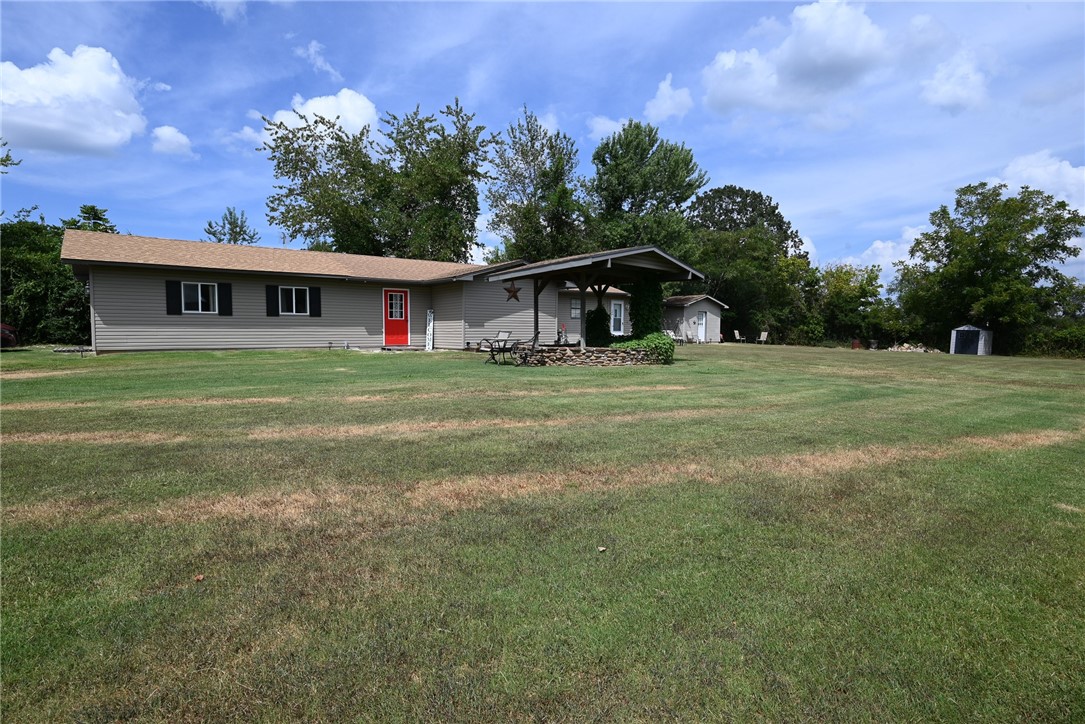 A Unique Retreat Just Outside of Town!
Discover this updated home with vaulted ceilings and a great, large, flat yard. It's the perfect blend of country living and city convenience.
This home is marketed as a two-bedroom but has potential for more. The second bedroom is accessed through the primary bedroom. A detached potential third bedroom/man cave/she shed is located in a finished detached permanent room currently used as a bedroom/music room.
The large great room is being used as the living room offers amazing potential to be partially partitioned off to create a spacious new primary bedroom suite, for 3 rooms under one roof.
This property provides great flexibility for buyers to customize the layout to fit their needs.
Disclaimer: All numbers, square footage, and information provided are deemed reliable but should be verified independently by the buyer.