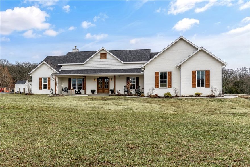 One of a kind custom built home on beautiful acreage with raised bed garden and chicken coop. Open floor plan with white oak beams and real hardwood flooring throughout. Side entry into mud/laundry room with brick tile flooring and bead board. Build in desk office area. Oversized kitchen island with sink and Signature Brand appliances. Designer pantry with all custom built-ins and European farmhouse doors. Living room has wood burning rock fireplace and picture windows. Oversized garage and additional outdoor patio areas for entertaining.