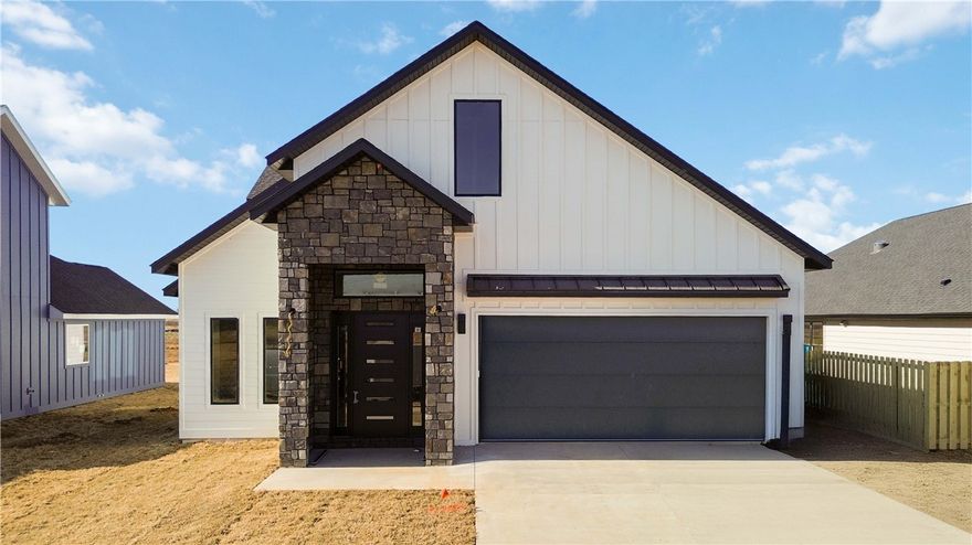 Welcome to Moonridge II, a New construction home with 3 generously sized bedrooms and 2.5 bathrooms. Features vaulted ceilings with abundant natural light creating open, airy living spaces. Gourmet kitchen equipped with modern appliances including gas range, microwave, and dishwasher. Luxurious primary suite with wet room-style bath/shower. Functional mudroom and covered porch for outdoor relaxation. 2-car garage for convenient parking. Energy-efficient gas heating and electric cooling systems with R15 insulation throughout. Quality Pella windows provide superior energy efficiency and durability. Fully fenced yard ensures privacy and security for your family.