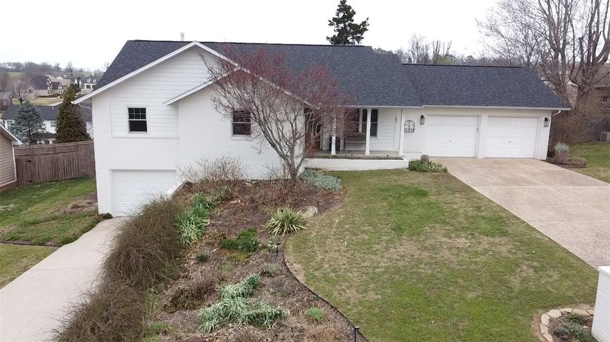 Beautifully updated 3-bedroom, 3 full bath home in a desirable Harrison neighborhood! Features include a 2-car garage on the main level plus an oversized 1-car garage in the basement—ideal for storage or workshop space. The inviting living area offers a cozy gas log fireplace. The home has seen numerous updates including newer windows, appliances, exterior siding and paint, roof, and tastefully renovated main and primary bathrooms—providing peace of mind and modern comfort. Enjoy the fenced backyard—perfect for pets or entertaining. Conveniently located just minutes from Harrison Country Club for dining, golf, and tennis. Approximately 35–40 minutes to Branson, 30 minutes to the Buffalo National River, and 30 minutes to Bull Shoals Lake. Move-in ready with comfort, updates, and a great location!