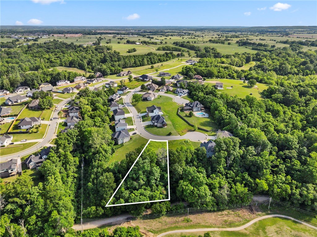 Build your dream home on Lot 37 Hopkins Lane in Pea Ridge’s Sugar Creek Residential Community. This gently rolling lot offers privacy at the end of a quiet cul-de-sac with views of Big Sugar Golf Course. All utilities are at the street, and you're just minutes from schools, shopping, and all that NWA has to offer.
Adjacent Lot 36 is also available for added space or a second homesite.