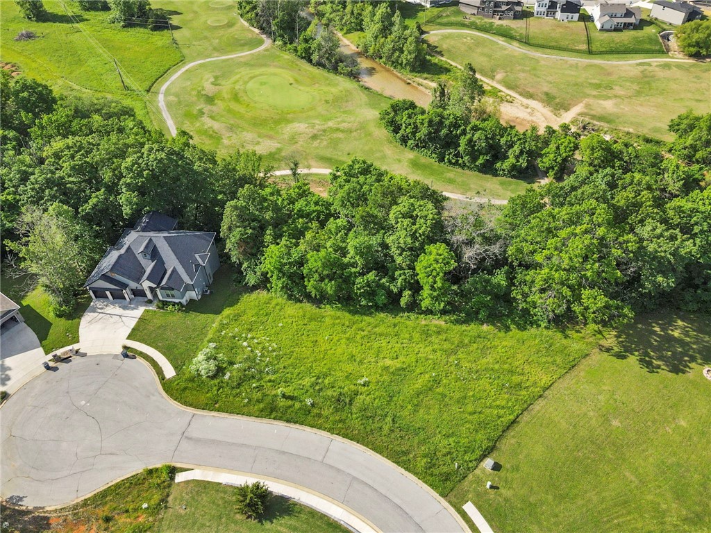 Build your dream home on Lot 37 Hopkins Lane in Pea Ridgeās Sugar Creek Residential Community. This gently rolling lot offers privacy at the end of a quiet cul-de-sac with views of Big Sugar Golf Course. All utilities are at the street, and you're just minutes from schools, shopping, and all that NWA has to offer.
Adjacent Lot 36 is also available for added space or a second homesite.