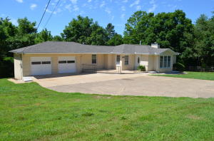 Newly remodeled home. Move in ready in excellent condition. Brand new roof. New paint through out. Kitchen cabinets updated and painted. Lots of new carpet. Bonus kitchenette down stairs. Large fenced garden area. Close to schools and downtown area. Convenient lawnmower shed/Workshop, Hardwood floors. Tons of storage space. Perfect for large family. Perfect for first time home buyers. Must see.
