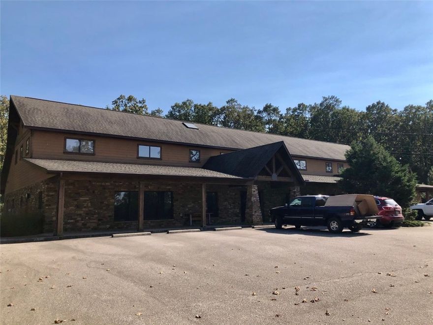 This two level building is perfect for office and/or medical.  Office portion has 2 executive office spaces with private bathrooms and fireplaces.  Conference rooms, break rooms, open concept office space, and many other private smaller office spaces.  Medical side contains it's own entry with reception, waiting, multiple exam rooms with sinks, and lab.  Lead lined room for x-rays.  Upstairs contains more larger office spaces, high end server room, conference spaces, and a kitchenette. Over 600 network drops.  1000 KW diesel generator.  High power capacity