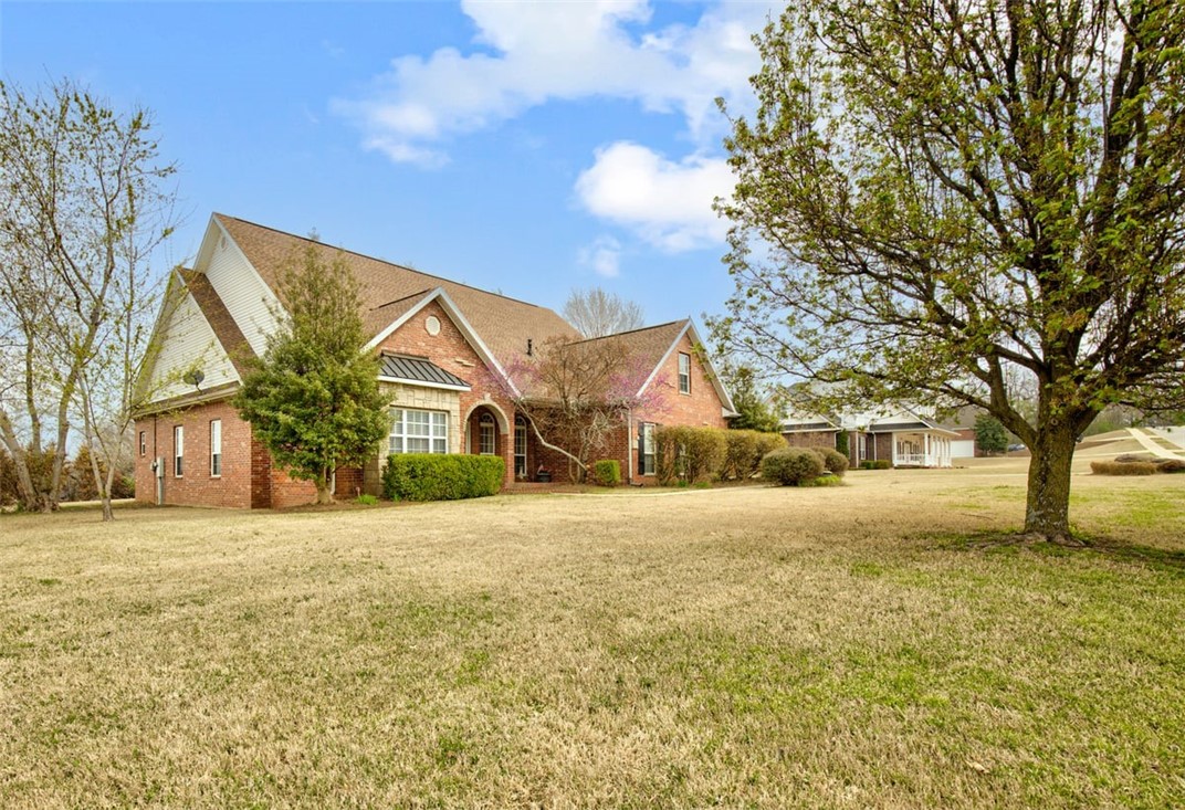 Location, Location, Location! This beautiful executive home is located in Belmont Estates! Close to I-49 and everything in NWA. Fantastic split floor plan in this home on a little over an acre! All 4 bedrooms are on the main floor. Formal living and dining rooms as well as an open eat-in kitchen and family room make this spacious home great for entertaining! Bonus room with wet bar, built-ins and storage on the second floor. Walk-in pantry, gas stove, two covered porches and a partially covered deck with a hot-tub that conveys with the property - make outdoor living perfect! Don't miss out on this one!
New Roof in 2015; Septic Pumped in 2017; HVAC Units replaced in 2013/2014; Updated kitchen with quartz countertops.
Ask about an allowance for carpet and paint