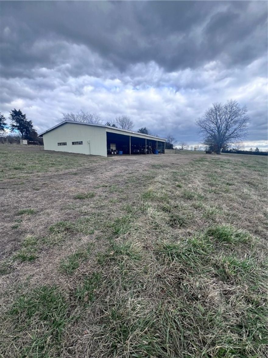 Mountain top land with a view! A 40X60 Barn/shop. A gorgeous 7+/-level piece of land with city water at the road and gated driveway. Build your dream home. Commute to NWA or Fort Smith with a short drive to I49. Land will need a survey to determine the correct amount of acres. Land cannot be divided. No Mobiles. Shown by appointment only.