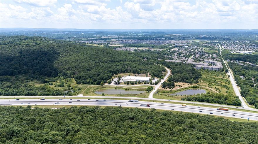 Looking for a high-impact site with serious potential? This 15.29-acre parcel along the I-49 CORRIDOR in Fayetteville is exactly that! Already approved by the City for High-Density City Neighborhood use and zoned CS, it’s a rare opportunity to bring multi-family, mixed-use, retail, office, or hospitality projects to life, all in one of the fastest-growing regions in the country. Just minutes from the University of Arkansas, major retail, grocery, apartments, and the trails of Centennial Park at Millsap Mountain, this location offers visibility, access, and a highly strategic position. Tech Way is surrounded by ongoing growth and development, making this a standout investment for builders who are ready to move. Zoned, accessible, and right where Fayetteville is headed. Also available as part of a four-parcel, 29.57-acre assemblage - see MLS #1316450 for full offering.