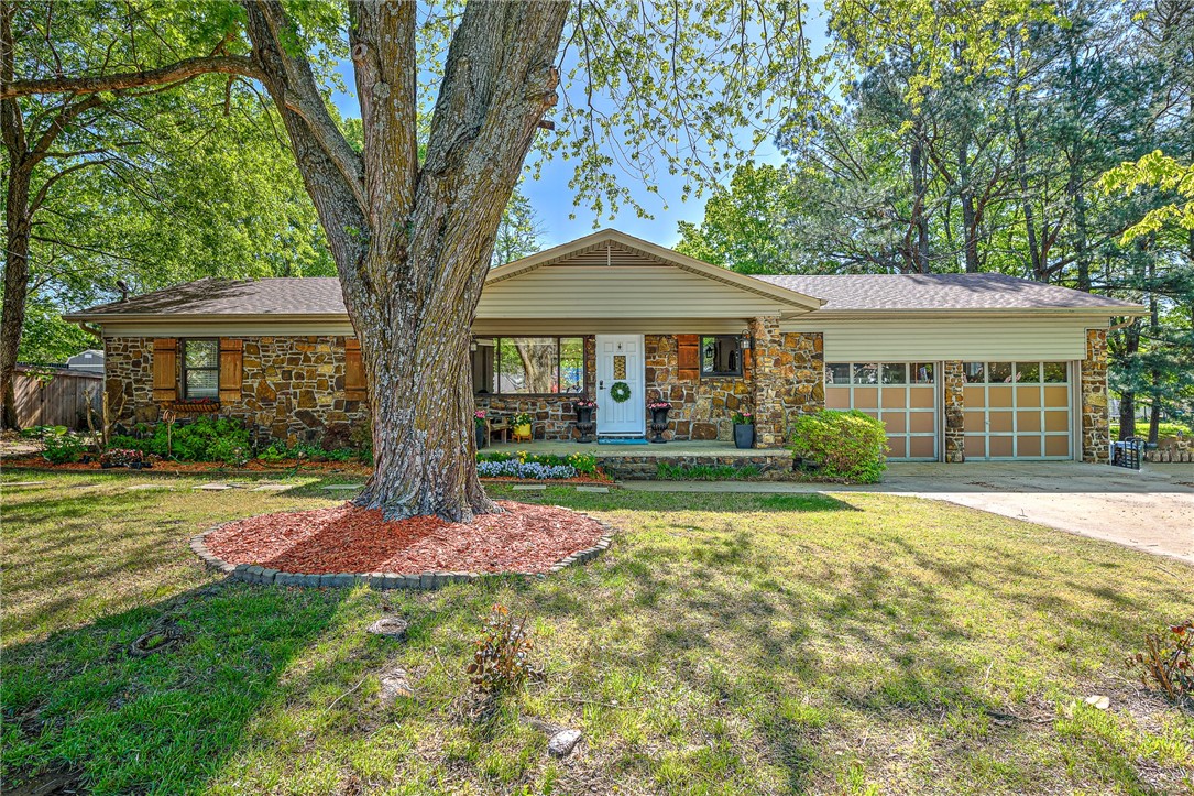 Welcome to this charming and cozy 2-bedroom, 1.5-bathroom home in lovely West Fork, AR! Situated on a spacious 1.22-acre lot, this home offers plenty of room for outdoor activities & even plenty of space for a garden. Step inside to discover a warm and inviting living space with a wood-burning stove, perfect for those chilly nights. The roof was recently replaced in 2021, ensuring that you can enjoy peace of mind for years to come. Enjoy the fresh air and beautiful views from the large deck off the back of the house or gather around the firepit in the backyard for some quality time with loved ones. A new custom sliding glass door & several new windows add to the overall appeal of this adorable home. Take in the scenic beauty of the area from the cute front porch, & appreciate the convenience of being located near I-49, making commuting a breeze. This home is perfect for those looking for a peaceful retreat with plenty of room to enjoy the outdoors. Don't miss your chance to make this delightful property your own!