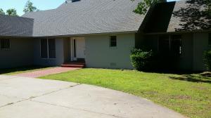 Wonderful location in a very desirable area is where you will find this spacious home on over an acre. Home features a wonderful private back yard complete with pool, cabana and large deck. Inside you will find a large living area with fireplace, spacious kitchen, formal dining, sunroom with wet bar area that opens onto deck overlooking pool.Huge master suite and bath on main floor.Just off the