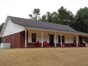 LIVING IN THE COUNTRY WITH A VIEW. Very nice 1500 sq ft newer 3/2 brick home on 2.94 acres. Raise livestock and your family in the quiet with a view of the mountains. New Survey.