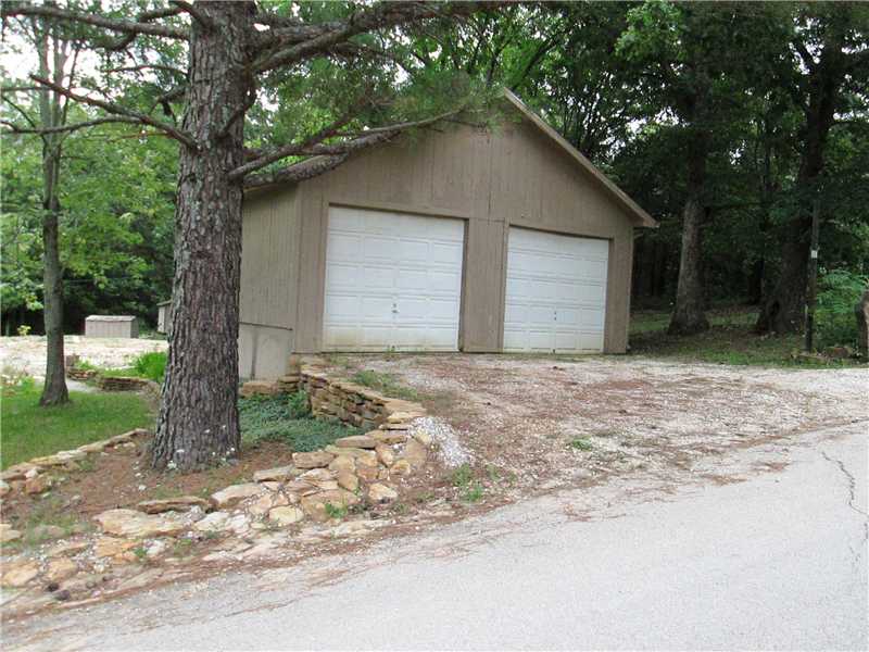Building ready 1.5 Acre for your home or mobile. 2 Stall garage and existing septic, water and electric. Foundation area prepped and ready to go. Close to Garfield Elementary and within city limits. Retaining wall, lawn and landscaping in place.,Garage has electric. Sheds. Just come build without the hassle of site preparation.