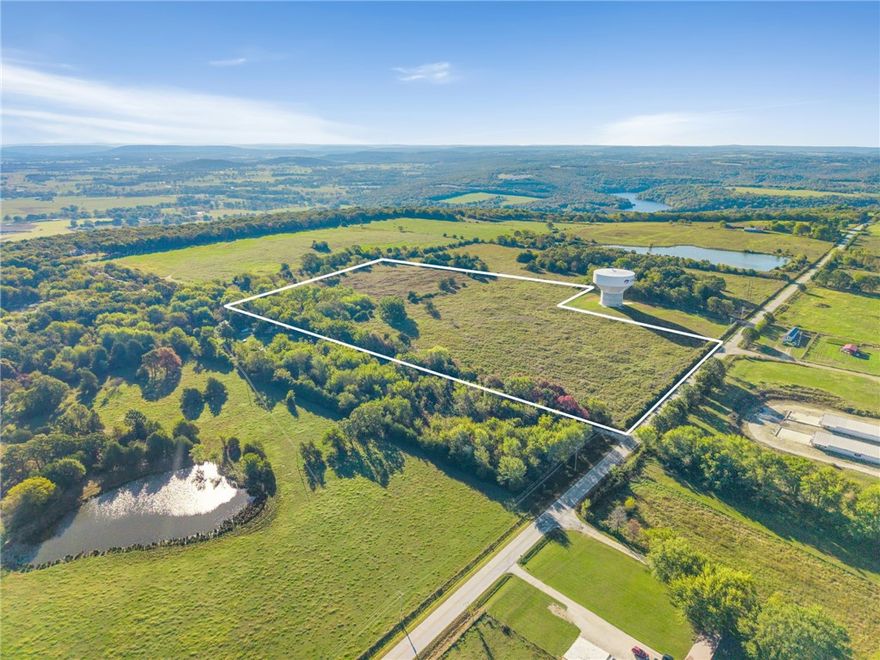 21.26 AC Homestead - Just N of Lincoln Lake, along Jackson Hwy, this 21.26 AC also has access along Hunton Ln. This is a great location for building your dream home or a secluded getaway. Enjoy the scenic ridgetop w/breathtaking views while utilizing the established pasture/hay ground for livestock. The property includes a 1008 SF-1914 farmhouse with 2BR/1BA, full of character & good bones, ready for restoration or a weekend retreat. Several outbuildings add to the charm & functionality, including a historic log smokehouse & several barns, perfect for those who appreciate heritage & craftsmanship. Shaded by century-old oak trees & mature hardwoods, the property offers peaceful seclusion w/the added bonus of being within minutes of town. Enjoy privacy & convenience, just 10 minutes to Lincoln schools, shopping, gas & dining, 20 minutes to Siloam Springs or historic Prairie Grove & only 30 minutes to the U of A. More land is available for purchase if desired. Also See MLS# 1326116, 1326221, 1326228, 1326244, 1326252