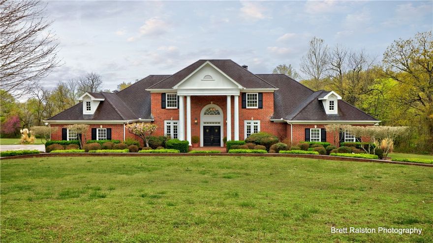 Beautiful estate home situated on 6.18 acres featuring in-ground pool, detached two-car garage/workshop, attached three-car attached garage. This gorgeous home features FLR, FDR, spacious den w/FP, soaring ceilings & windows overlooking backyard. Well-appointed kitchen opens into casual dining area. Library w/FP opens to MBR. Guest BR w/en suite BA on main level. Upstairs has 2 large BR, w/en suite bathrooms & walk-in closets. Both BR access large attic storage.  Lower level has carefree stained concrete floors that are great for entertaining. Fabulous custom-built, one-owner home. Built-in gun cabinet, safe, silver storage chest and amazing storage.  This elegant home has it all!!!  Additional 3.56 acres may be purchased for $300K by buyer of the home.