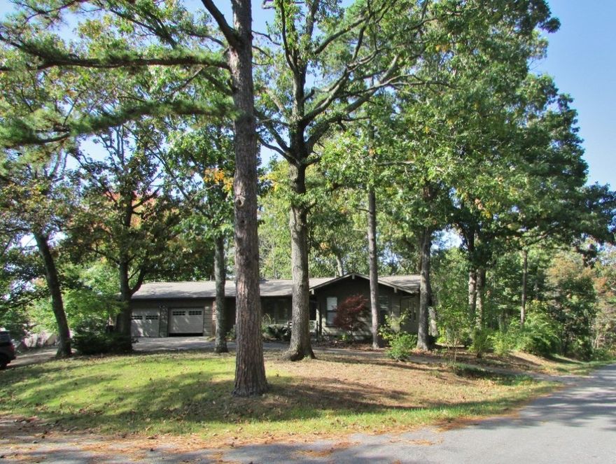 Oh my!  This is a great place to live.  This corner lot accommodates this house with about .72 acres.  Lots of trees and large back yard.  Inside is a fantastically open living room, kitchen, dining and sun room.  Walk in the front door and see through the house to the back yard.  Lots of windows and lots of light.  Outstanding master suite with large closet and huge bath.  The basement will bring to mind unending possibilities.  23 x 20 deck. Pellet stove.  What a great place to live.