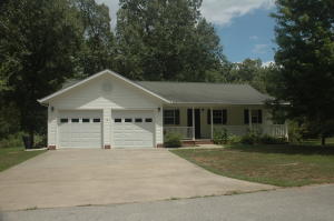Very nice 5 bedroom 3 1/2 bath home on approximately 1 acre. Large living room. Great kitchen and dining room with beautiful cabinets. Large master bed, bath, and closet with built in drawers. Two additional bedrooms with built in desks, all on main level. Nice 2 car garage on main level. Basement features large family room with gas log fireplace, also with nice cabinetry, and two additional bedrooms and great workshop and garage area. Nice landscaping and large deck.