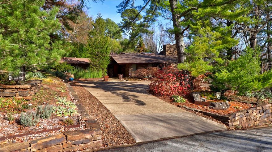 A mid-century masterpiece by E. Fay Jones, listed on the National Register of Historic Places, is now ready for a new owner to cherish. Extraordinary design and craftsmanship throughout. Tongue and groove clear cedar walls feature perfectly mitered corners. Six floor-to-ceiling mitered glass corners. Massive stone walls. Two interconnected fireplaces flank the upper and lower living areas. Flagstone flooring throughout.  All updates sensitive to the original design. Three en suite bedrooms with private patios to enjoy the open air. A separate building by David McKee (2015) features a studio, carport, and conditioned storage. This home is an architectural work of art. House Beautiful called it “Magnificent Space on a Magnificent Site.” You can call it home.