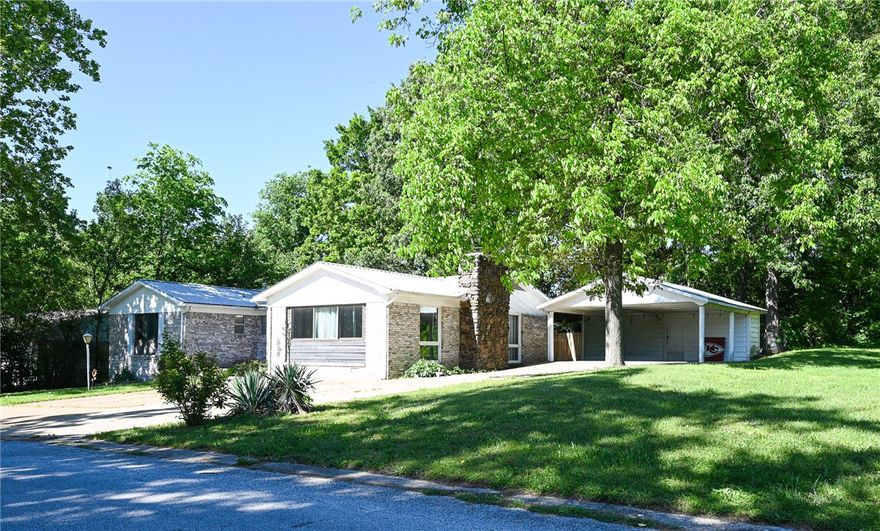 Rare opportunity in an established Harrison neighborhood! This expansive brick home sits on a sprawling double footprint, including a bonus lot that offers incredible extra outdoor space. Inside, you'll find a great floor plan highlighted by a huge bonus room, perfect for a home theater, gym, or second living quarters.

The home features durable brick construction, a metal roof, and beautiful hard flooring throughout. Featuring a cozy fireplace and generous living areas, this house offers plenty of versatile space to fit your needs. Located just minutes from shopping and dining, this property provides the perfect blend of size and stability. All information and measurements are deemed reliable but to be verified by buyer.
