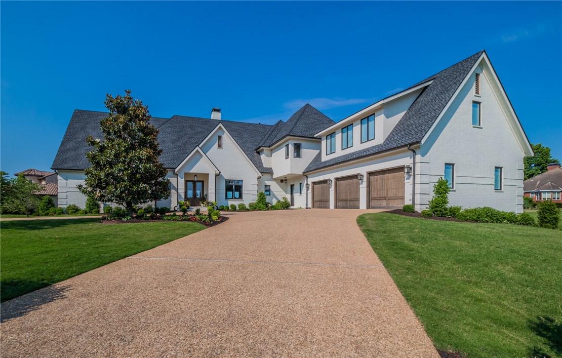 Take advantage of a rare opportunity to own almost 1 acre on prestigious Pinnacle Drive in Pinnacle Country Club overlooking the 17th green. This completely remodeled custom 6,879 sq ft 3 level home features 5 bedrooms, white oak premium hand-scraped hardwood floors, Smart Home Technology (control 4), new fireplace, 2 laundry rooms & all new professional landscaping to just name a few. Private Master Suite with large walk in closet with island, quartz countertops, gourmet Kitchen open to Living Room and wall of windows with impressive views of the golf course. Walk-out basement features 2 bedrooms, 3 bathrooms, eat-in kitchen with bar, media room & fitness area. Multi-level decks & patios perfect for entertaining with large flat backyard and separate golf cart garage.