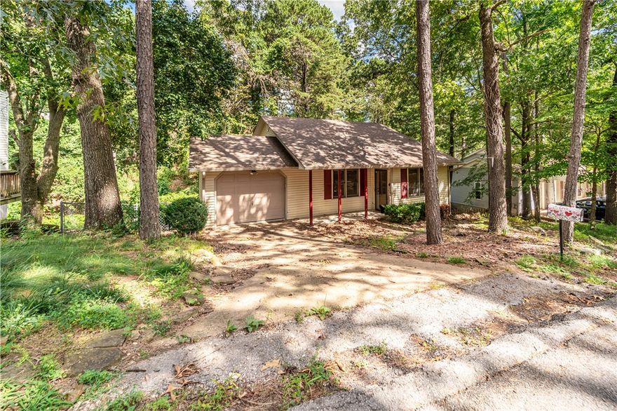 Charming Home with Treehouse Views and Modern Upgrades. Enjoy a serene treehouse-style view from this beautifully updated home, ideally located on a quiet cul-de-sac just minutes from downtown. The open floor plan is both inviting and functional, highlighted by manicured landscaping and timeless wood double-hung windows. Inside, you’ll find tile and hardwood flooring throughout, a cozy gas fireplace, and recently painted interior walls accented with vintage crystal doorknobs. The updated kitchen boasts smart lighting, new stainless steel appliances—including a refrigerator, dishwasher, and multi-function microwave—and a washer and dryer that convey.The one-car garage and spacious primary bedroom both offer direct access to the back deck, which overlooks a freshly installed wood privacy fence. Downstairs, the partially unfinished basement is heated and cooled, making it ideal for storage or future expansion. This home blends comfort, character, and convenience—don’t miss your chance to make it yours!
