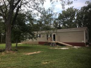 Newer, well kept mobile home on 8+ acres between Harrison & Branson, MO! This 3BR/2BA mobile home has been well cared for sits on a mostly level 8+ acres with lots of paved road frontage in Omaha!